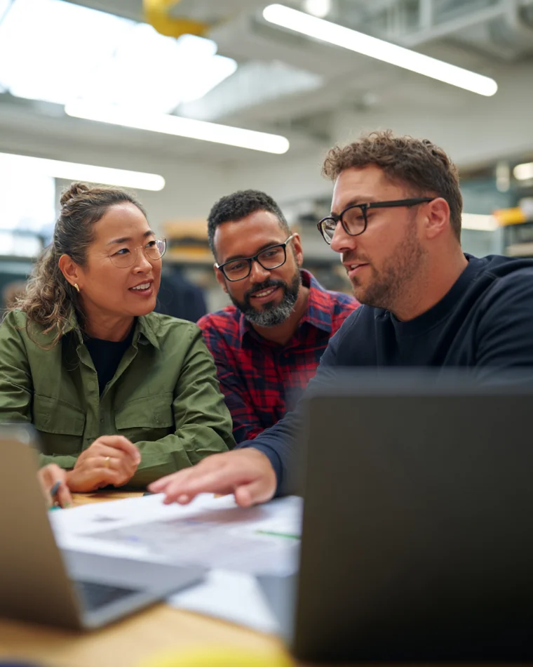 A small project team reviewing plans together